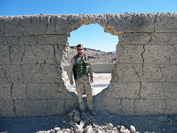 Now-1st Sgt. Landon Jackson poses during a mission outside of Shkin, Paktika Province, Afghanistan, in 2004. The deployment, he admits, was his most difficult out of four combat deployments, with improvised explosive devices exploding American vehicles before his eyes, and horrifying post-blast investigations that included dead children. It took him years to admit and accept that it had a lasting effect on him. After his wife kicked him out and he almost killed himself, he finally drove himself to the emergency room and admitted he needed serious help. Now he’s on a mission to help other Soldiers. (Photo courtesy of 1st Sgt. Landon Jackson)