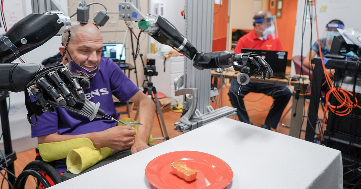 Man Moves Robot Arms With Brain Computer Interface