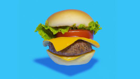 a cheeseburger on a blue background