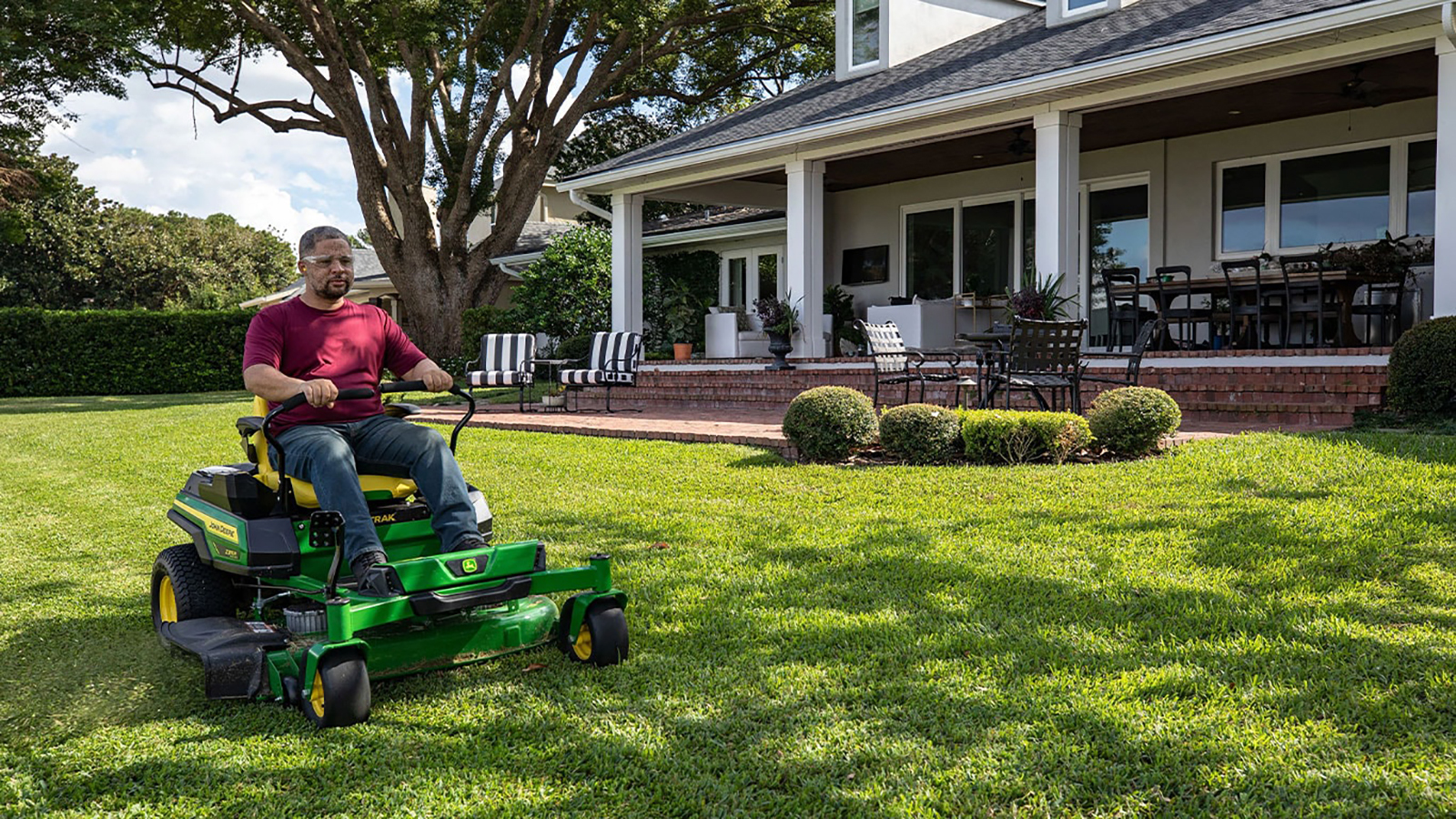 John Deere unveils quieter, electric riding mowers