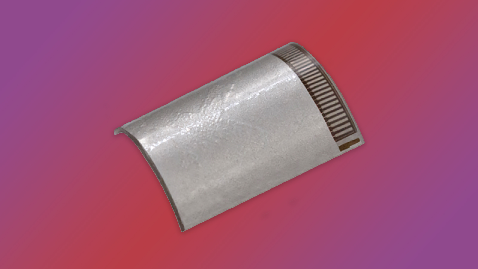 a thin, silver piece of material on a colorful background