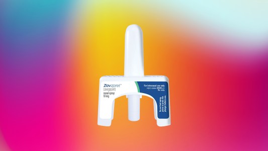 a nasal spray bottle on a colorful background