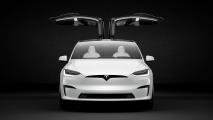an image of a tesla from the front with its doors open