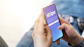 a phone displaying Stripe's logo