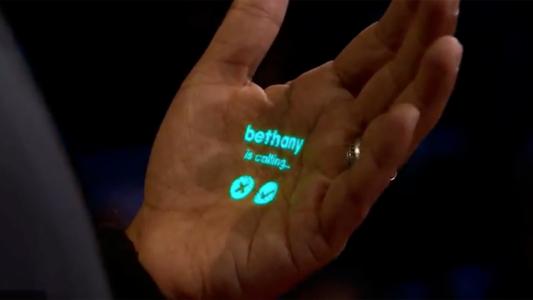 the words "Bethany is calling" projected onto a man's palm