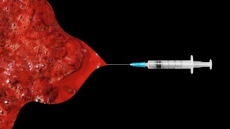 an image of a syringe and blood
