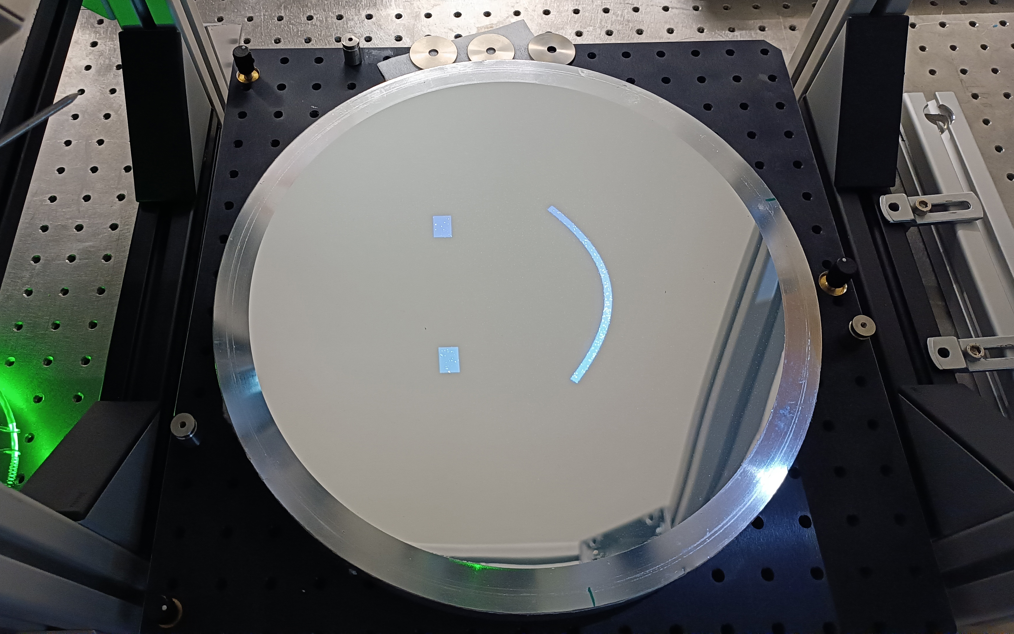 a circular mirror with a smily face illuminated on it