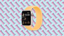 an iwatch with a yellow band on a pattern of pink dumbbells