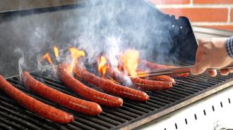 sausages cooking on a grill