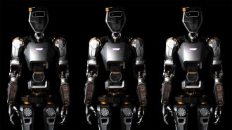 an image of three humanoid general purpose robots from the thighs up