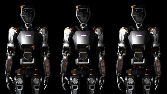 an image of three humanoid general purpose robots from the thighs up