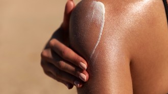 a person applying sunscreen