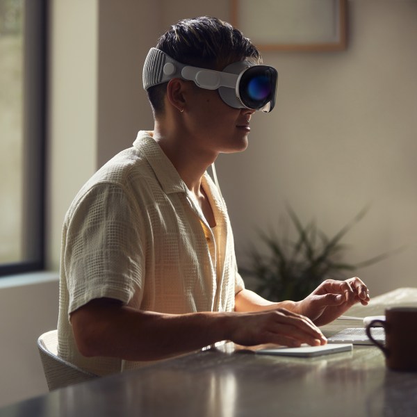 A person working wearing Apple's AR headset