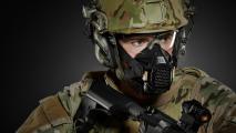 A soldier protected from toxic exposure by a mask