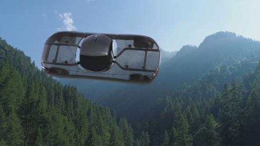 a render of Alef Aeronautic's electric flying car soaring above a forest with trees