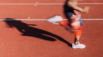 A woman engaged in exercise on a track.