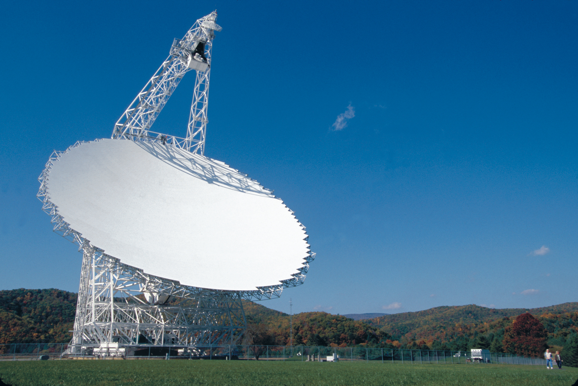 a large telescope in a field.