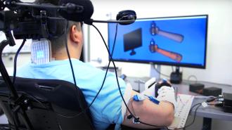 A quadriplegic man utilizing an AI-powered brain implant