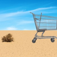 A shopping cart in the desert.