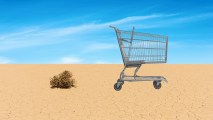 A shopping cart in the desert.