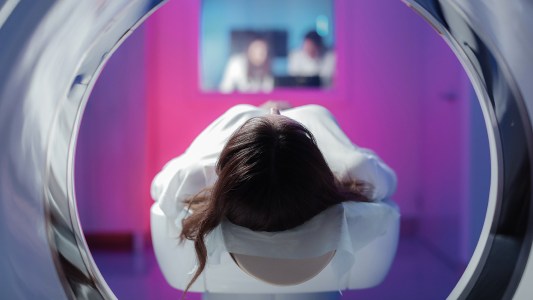 a woman about to get an MRI scan