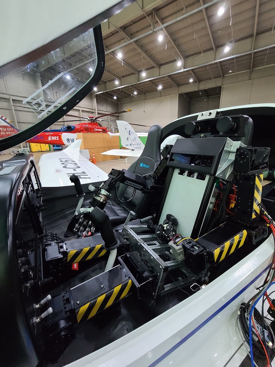 the PIBOT robot in a plane's cockpit