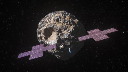 An artist's rendering of the Psyche mission spacecraft near 16 Psyche, an asteroid.