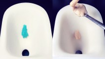 A spoon is being used to scoop synthetic feces into a tiny toilet bowl.