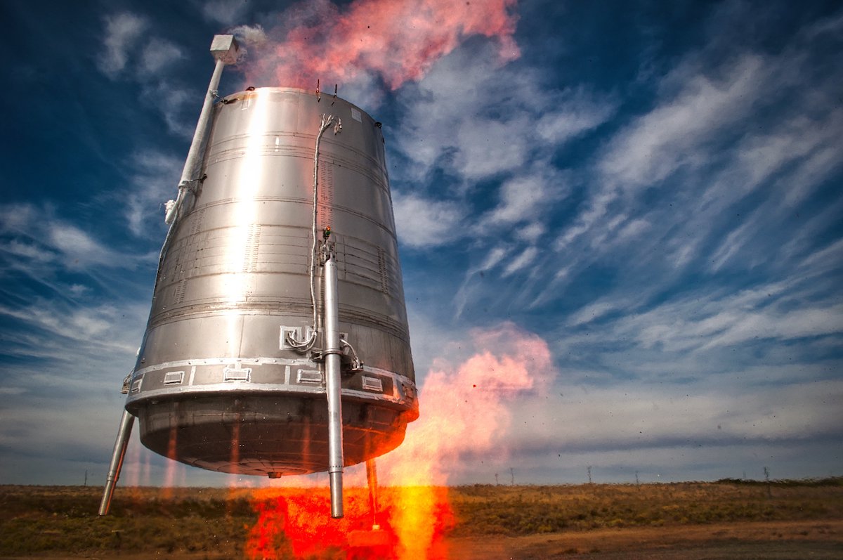 Stoke Space's test vehicle, Hopper2, mid flight with fire coming out of its bottom