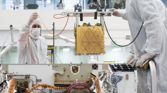 Two men conducting ISRU research in a spacecraft laboratory.