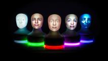 A group of robotic busts with different color lights at their bases
