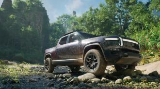 A pickup truck is parked in a rocky area.