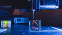 a tiny replica of a heart being created through 3D bioprinting