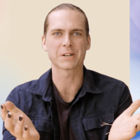 A man with his hands out in front of a blue background.