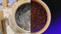 A picture of a coffee grinder refining whole coffee beans.