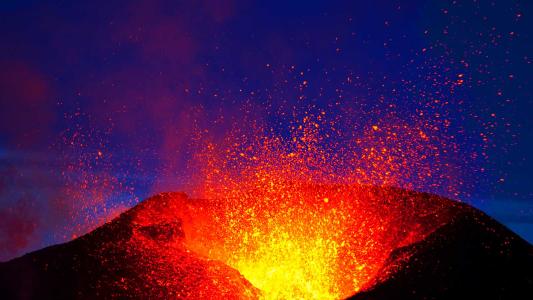 An awe-inspiring volcano in Iceland spewing fiery lava.