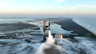 An aerial view of a SpaceX's Starship taking off.