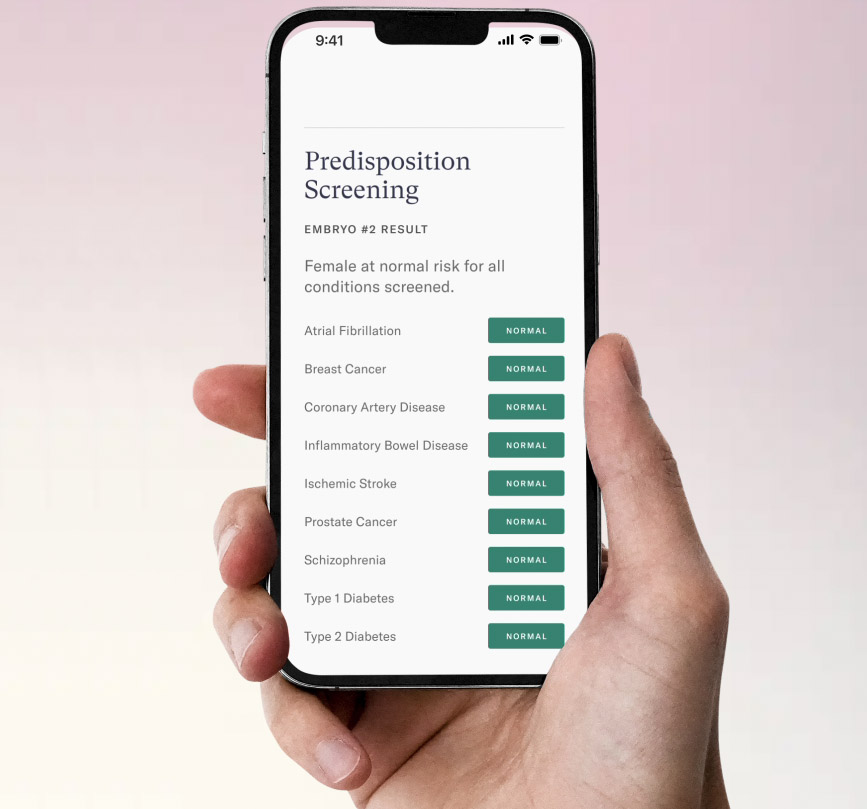 A person holding up a phone with a screen displaying the results of their embryo screening