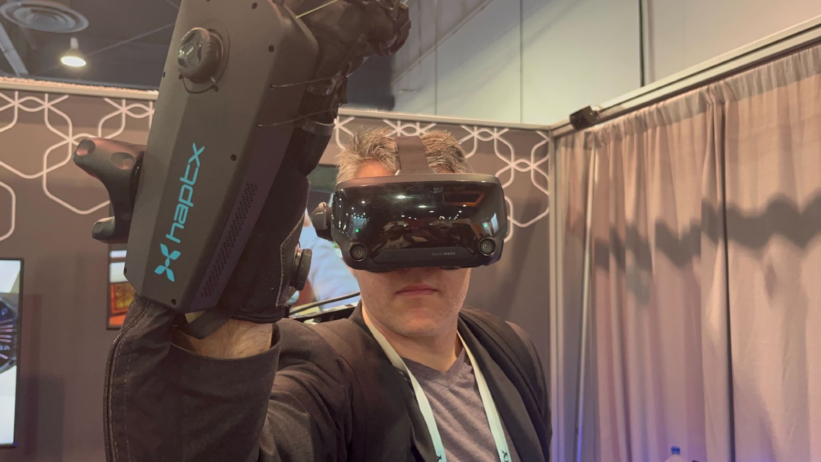 A man holding a vr headset up to his face.
