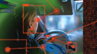 An image of a woman driving a car with car cameras.