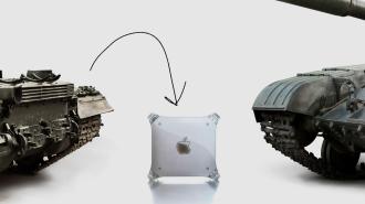 A military tank next to a Power Mac G4
