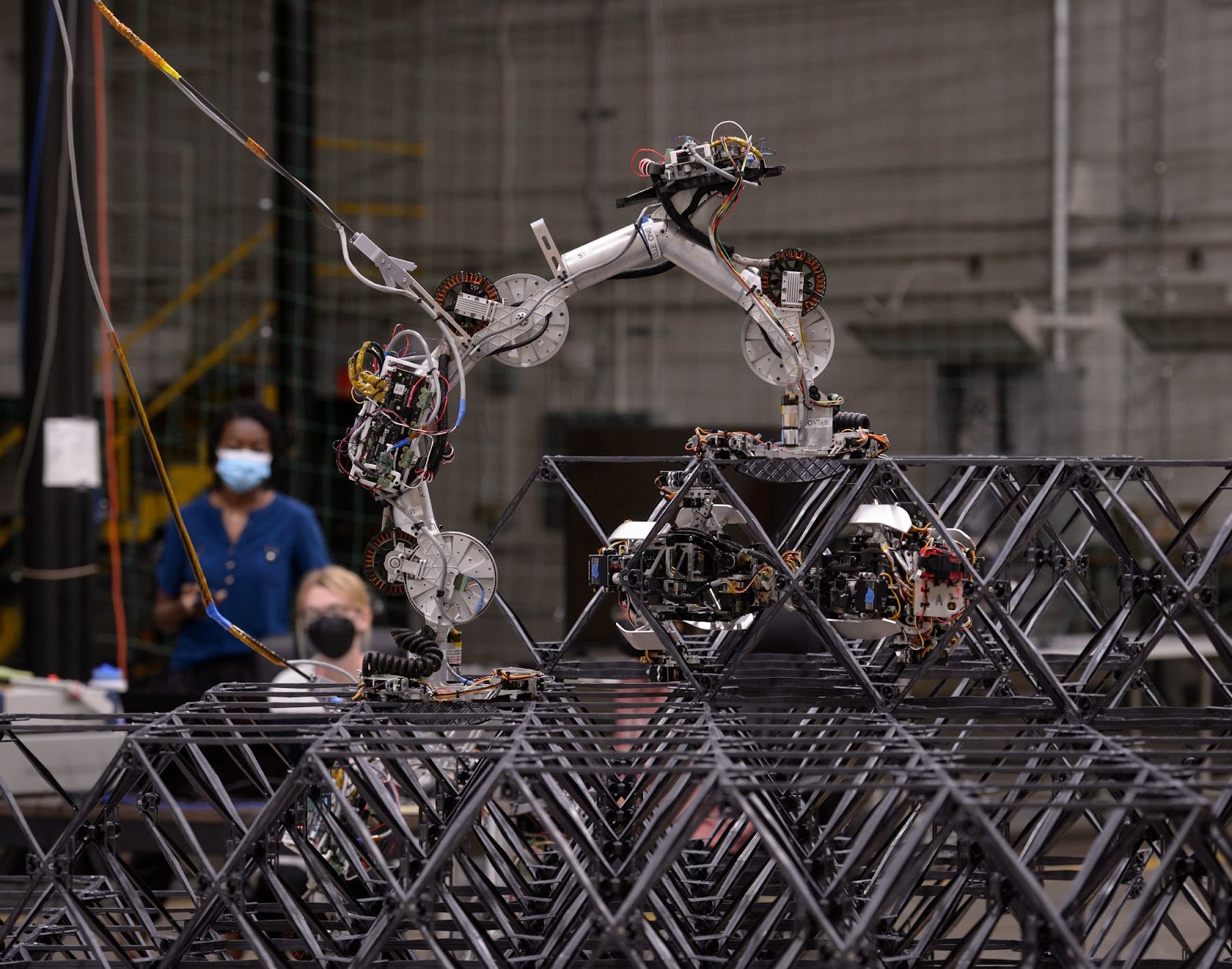 Two of NASA's space robots working to build a structure