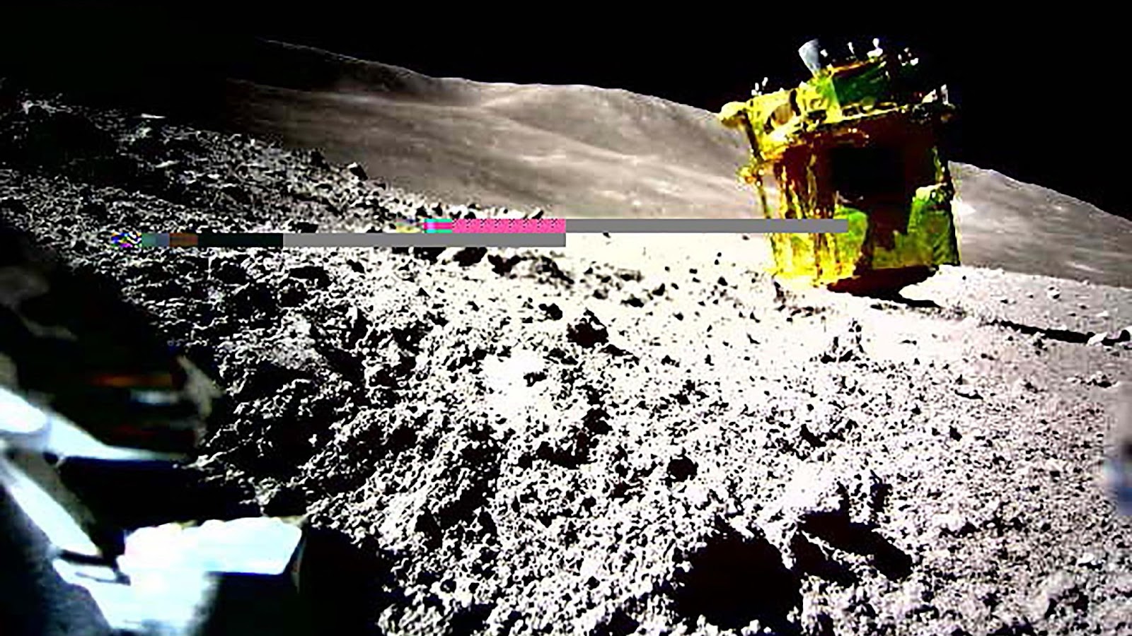 a photo of the upside-down SLIM lander on the moon