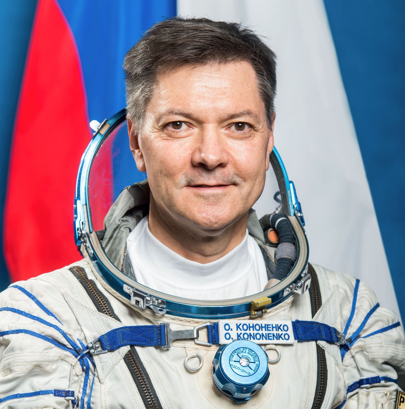 Cosmonaut Oleg Kononenko posing for a photo