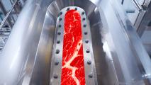 An image of a red meat in a stainless steel tube.