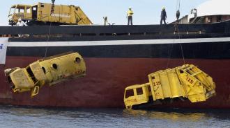 A boat with a bunch of artificial reefs on it.