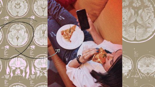 A woman eating pizza out of boredom and holding a phone.