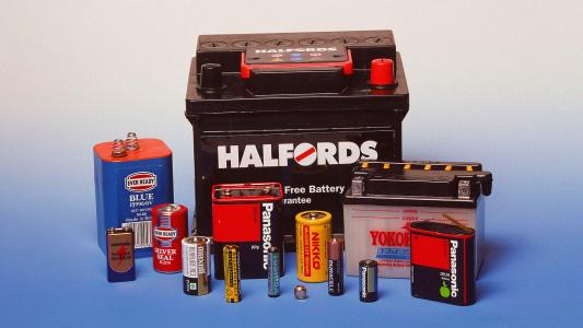 Various automotive products and battery types from brands like Halfords and Panasonic displayed on a light blue background.