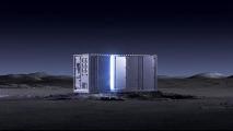 A high-tech modular structure illuminated by blue lights, standing on a barren, moon-like landscape at night.