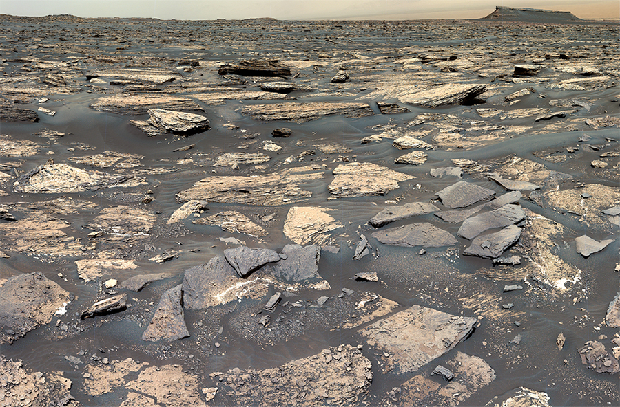 An image of Mars’ Gale Crater taken by the Curiosity rover. It is rocky and desolate.
